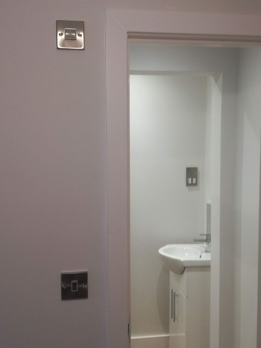 Ensuite with stainless steel switch plates