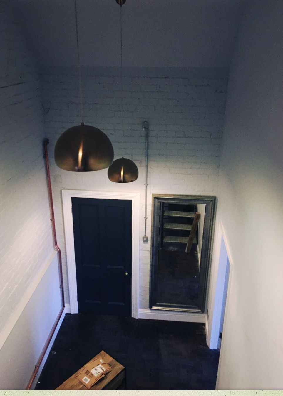 Hallway with copper pendant lights