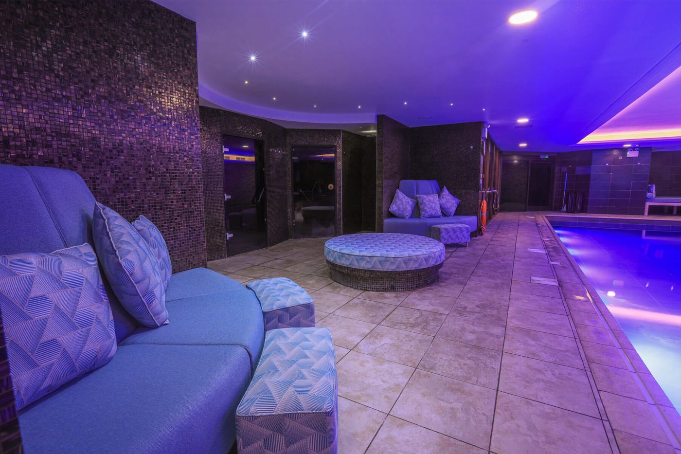Hotel spa with blue LED ceiling and pool lighting