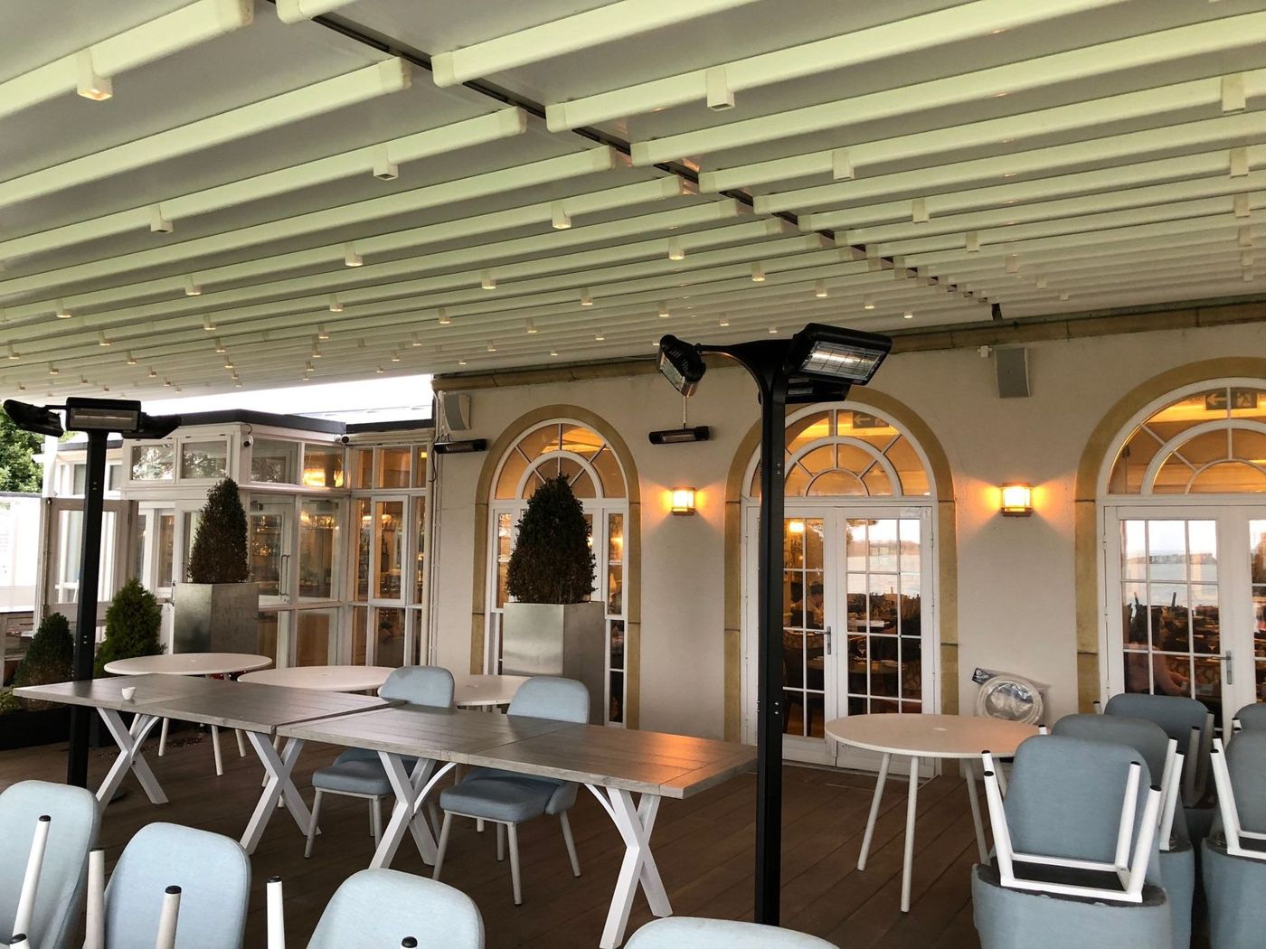 Upper deck terrace with wall lights and patio heaters