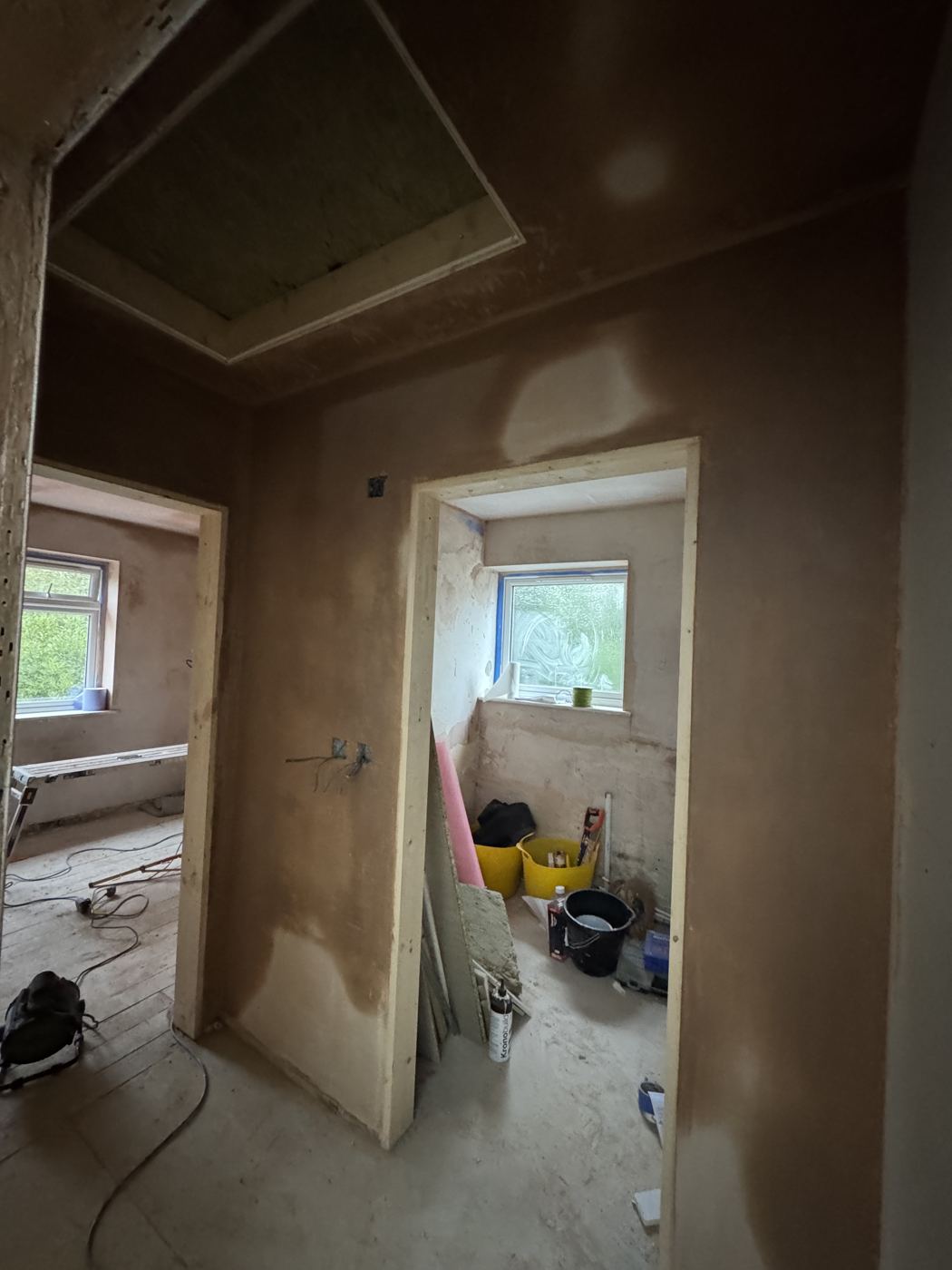 Hallway and bedroom after plastering