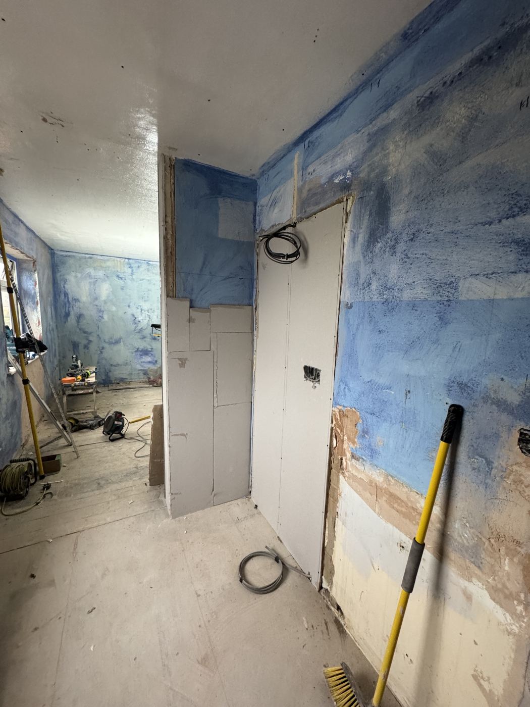 Lounge and kitchen walls sealed ready for plaster