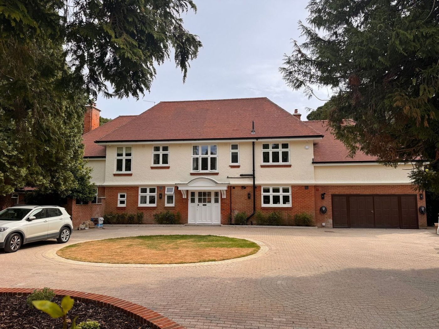 Front of the renovated house with new driveway