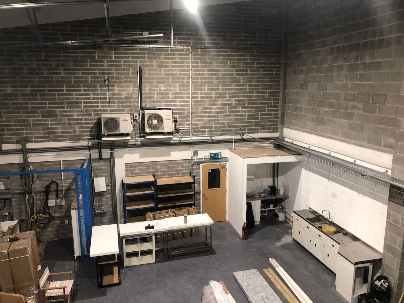 Fitted-out unit with kitchen and storage