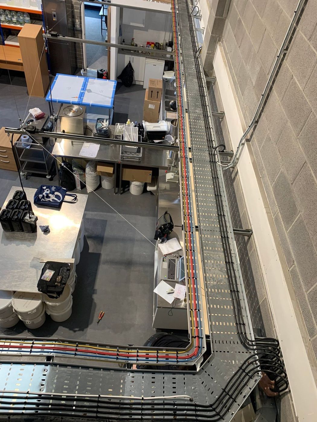 Cable tray and containment around a commercial unit
