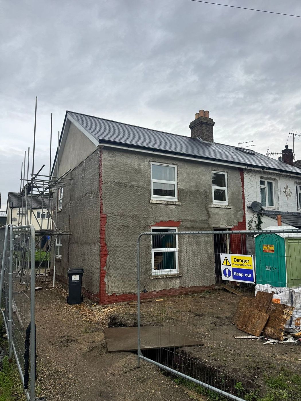House re-rendered under scaffold