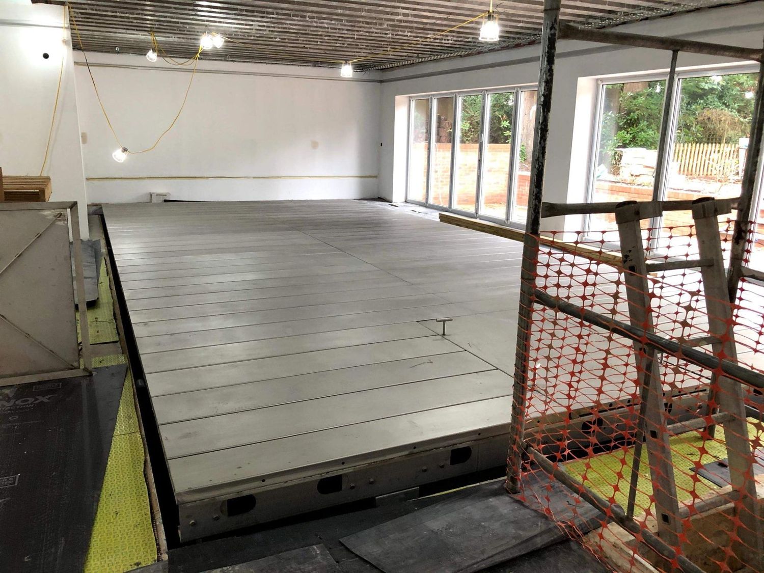 Pool hall with the movable pool floor raised during the build